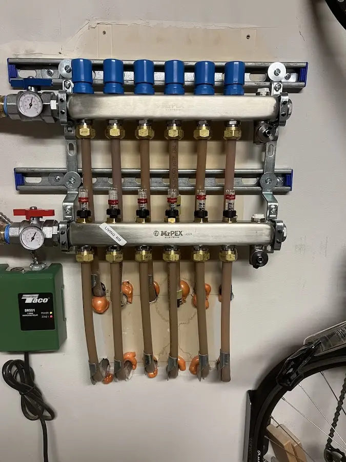 Plumber performing Gas Leak Detection at a residential property in West Greenwich